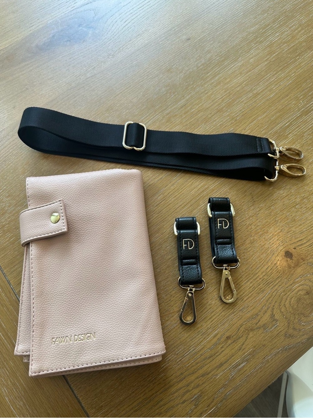 Fawn Design Blush Pink Changing Pad with Black Diaper Bag Strap and Gold Clips